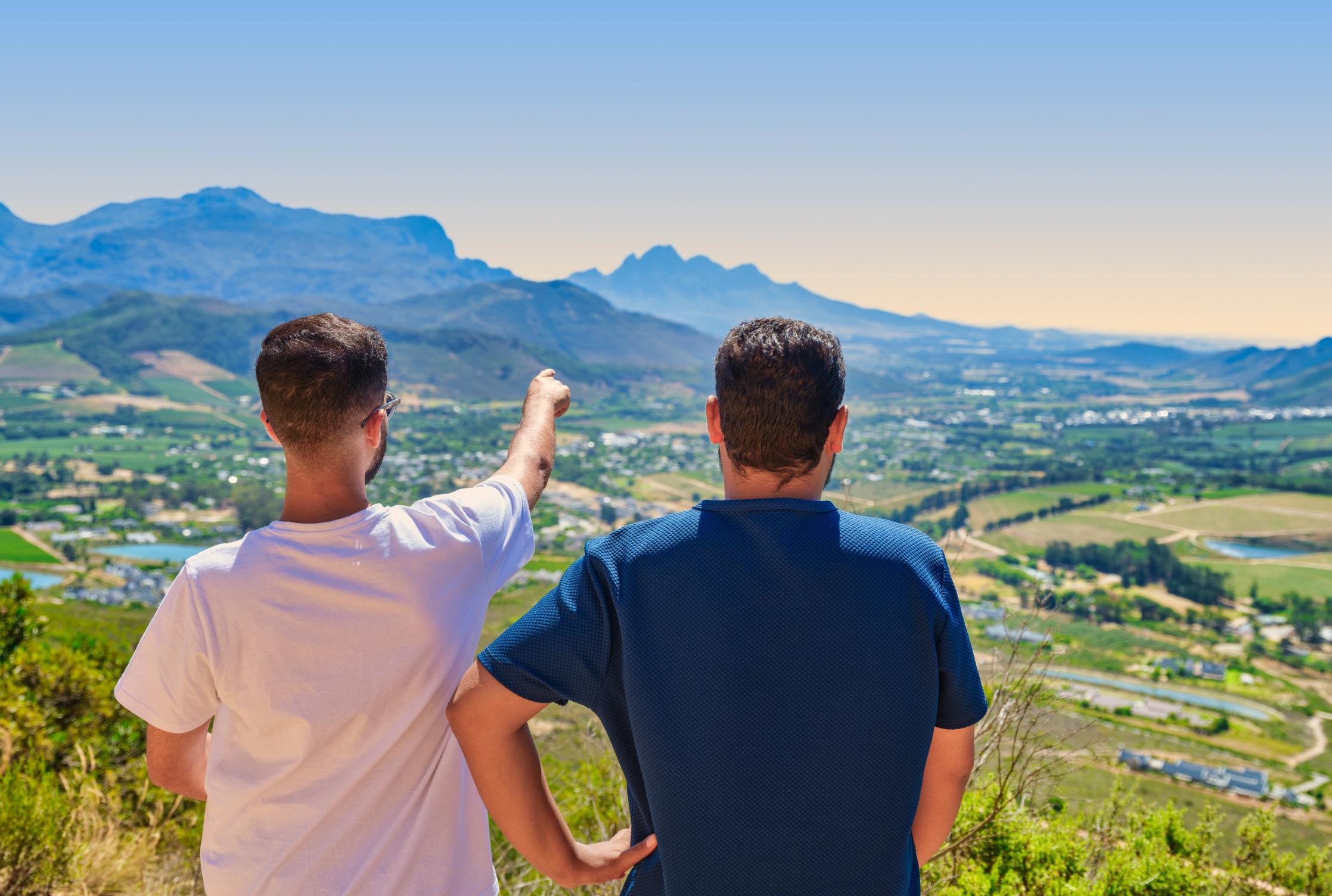 A pair of tourists taking in the scenic view of Franschhoek Wine Valley