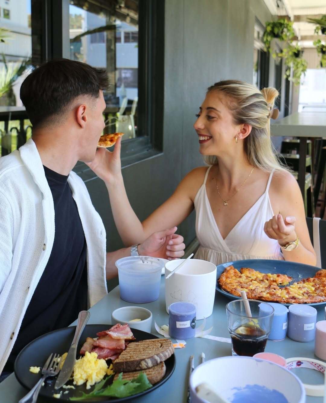 Couple dining and painting pottery at Clay Cafe in the city