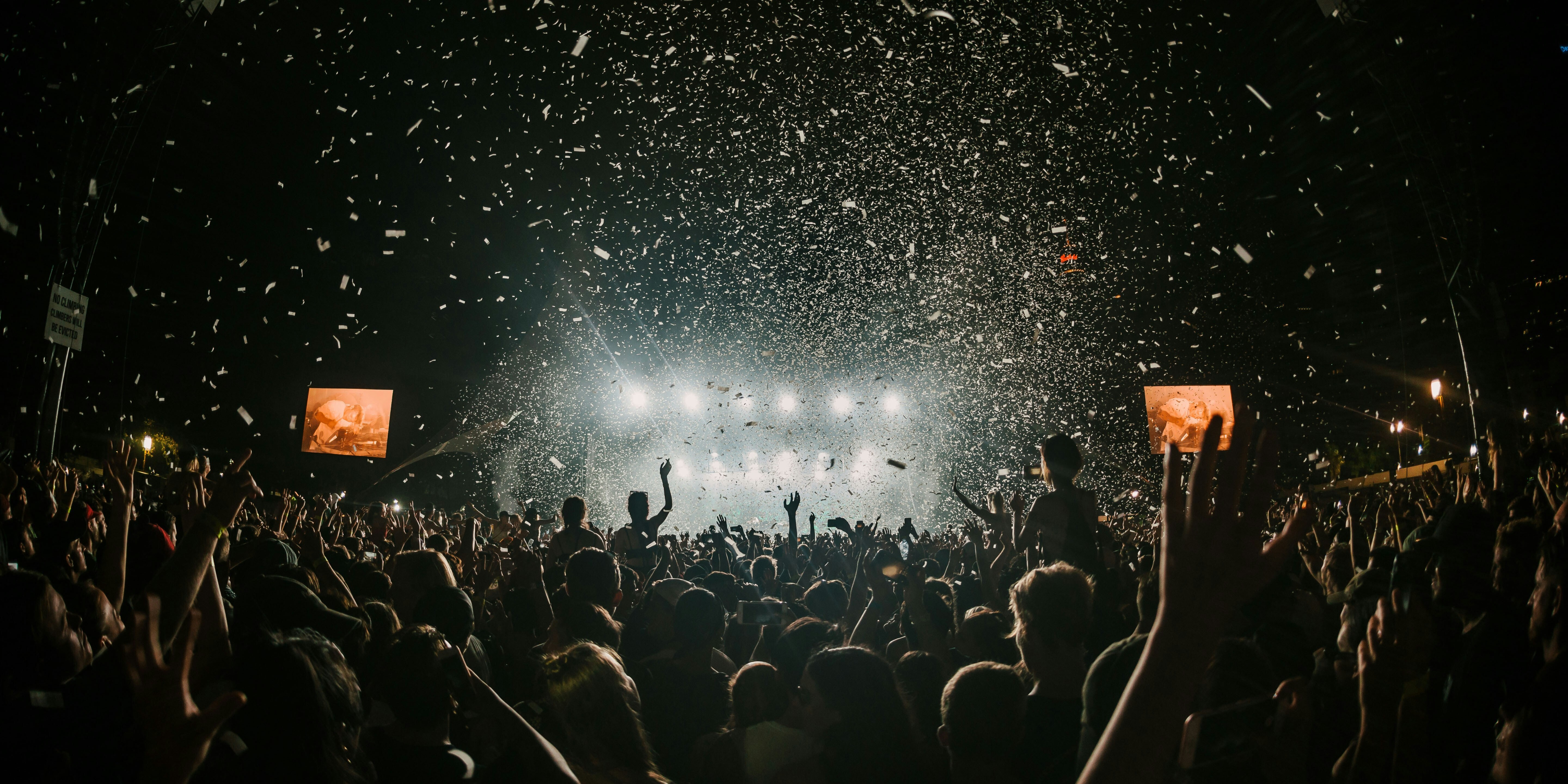 Crowd cheering with confetti NYE