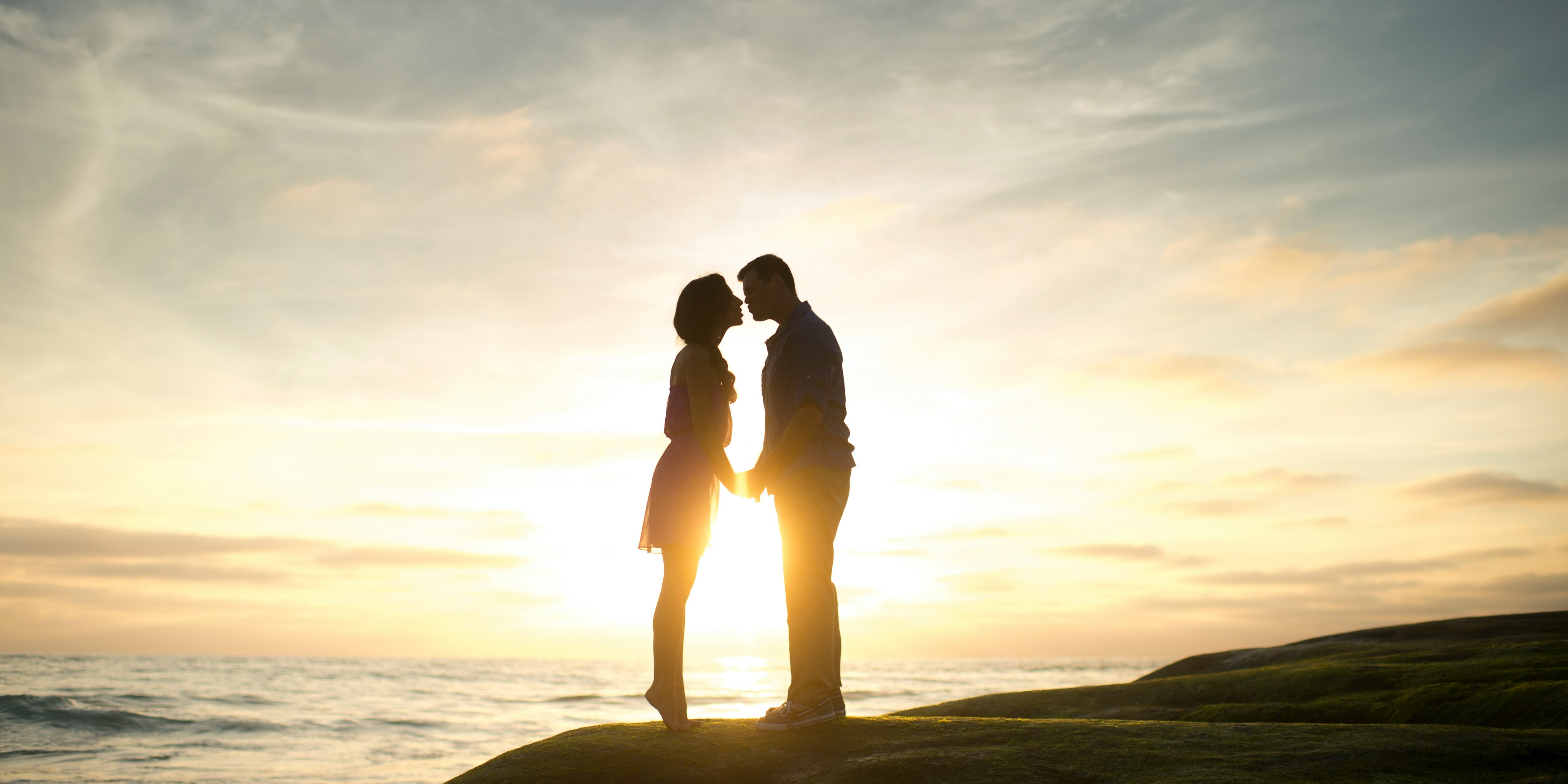 Couple embracing at sunset