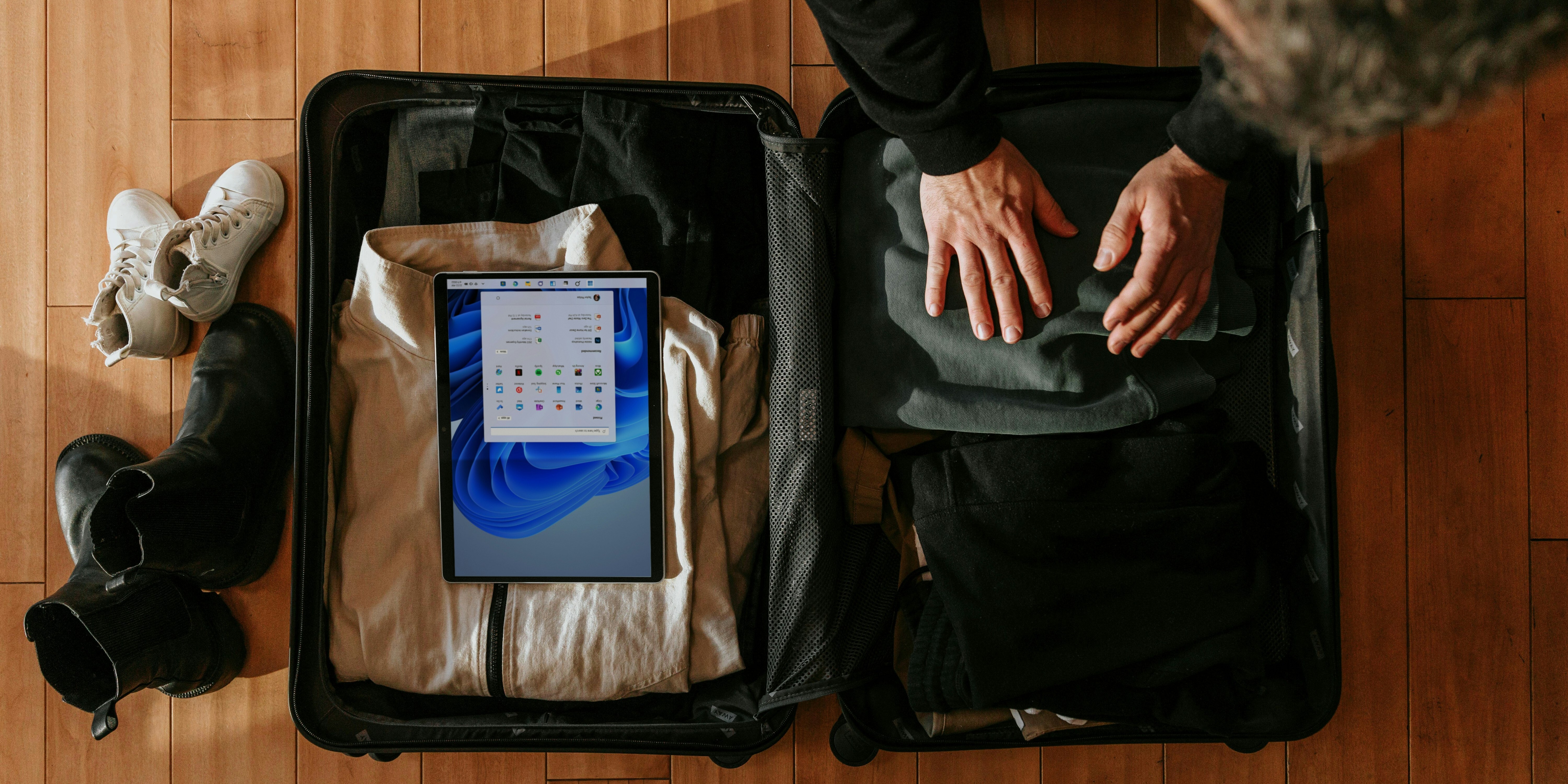 Man packing suitcase for a trip